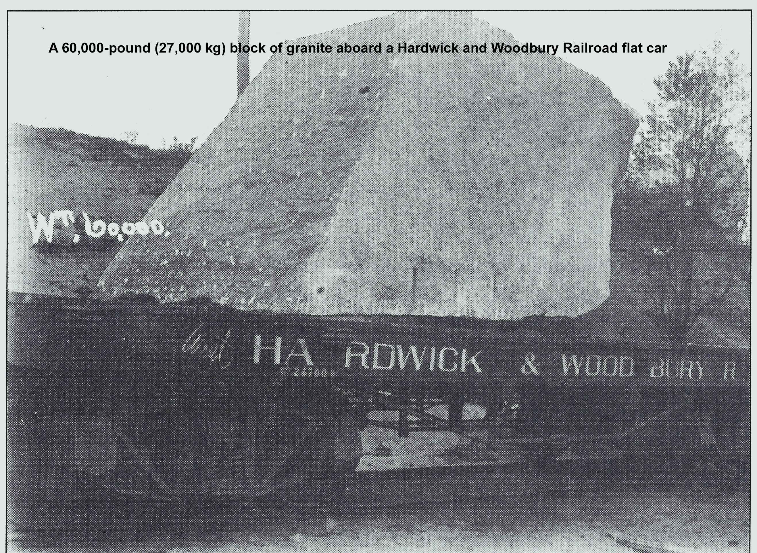 A 60,000-pound (27,000 kg) block of granite aboard a Hardwick and Woodbury Railroad flat car. Hardwick & Woodbury Railroad